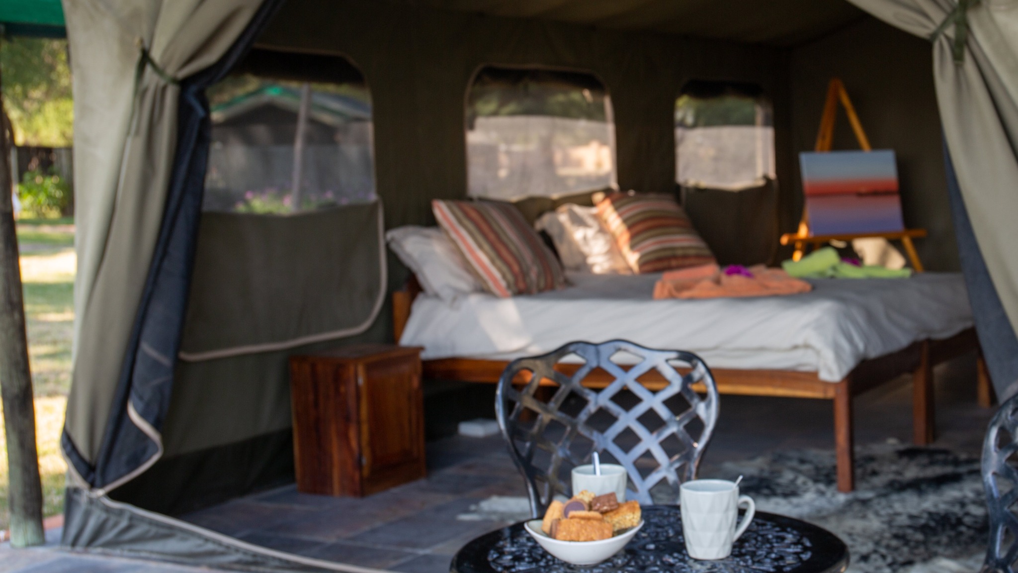 Made bed inside a Meru safari tent